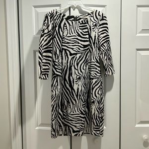 Dex. Woman’s black/white, long sleeve dress. Black/chrome back zipper